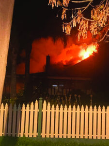 Youth seen running from nearby house fire