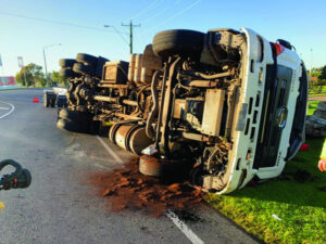 Man walks after truck cabin rolls