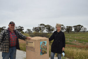 Landcare members decorate walking track