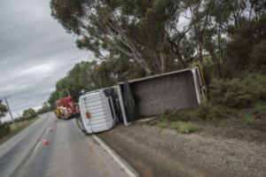 Truck rolls on highway