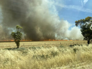 Lake Charm fire shut highway, burnt crops