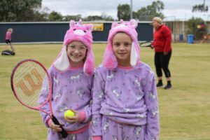 All dressed up for lawn tennis success despite rain