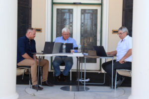 Three councillors protest outside council chamber